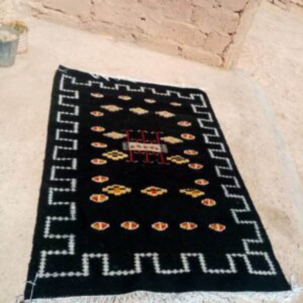 Traditional black rug